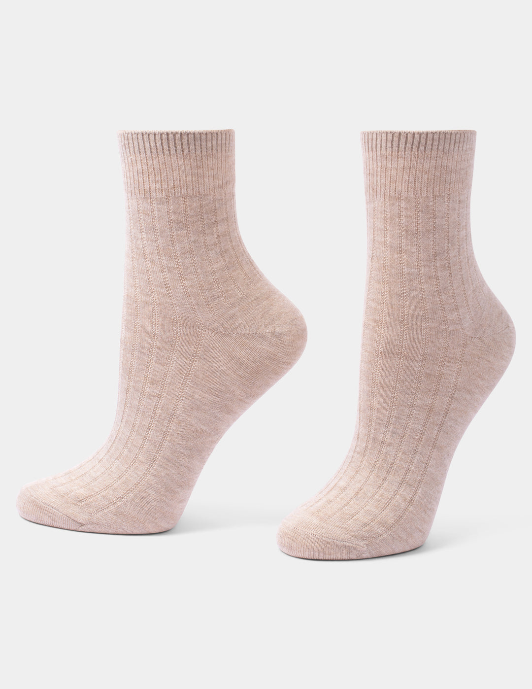 A pair of ribbed ankle socks in a light heathered blush oatmeal color, displayed against a clean light gray background.
