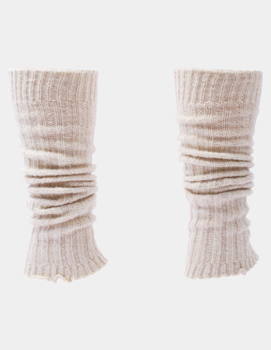 Ribbed light beige leg warmers photographed against a light gray background.
