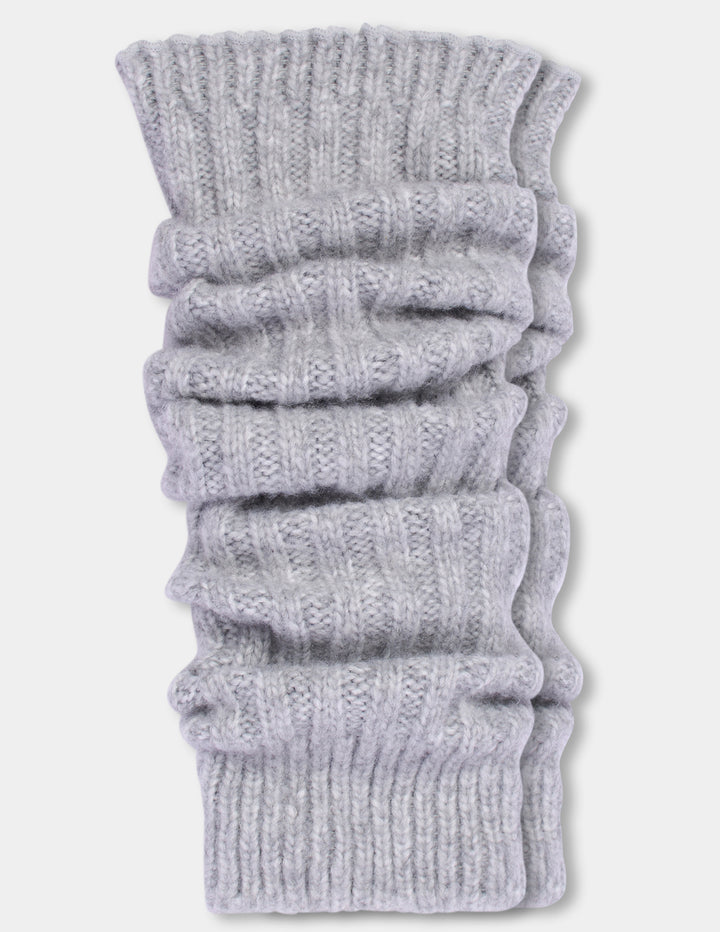 Ribbed grey heather leg warmers laying flat, photographed against a light gray background.