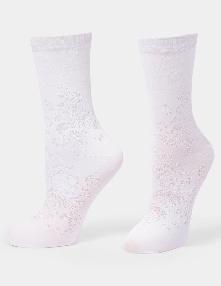 A pair of ivory crew socks with a floral textured pattern, shown against a light gray background.