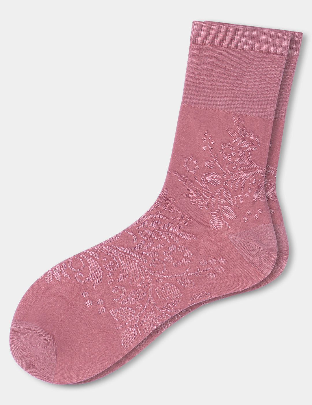 A pair of dusty pink crew socks with an embossed floral pattern on the foot, displayed against a light gray background.