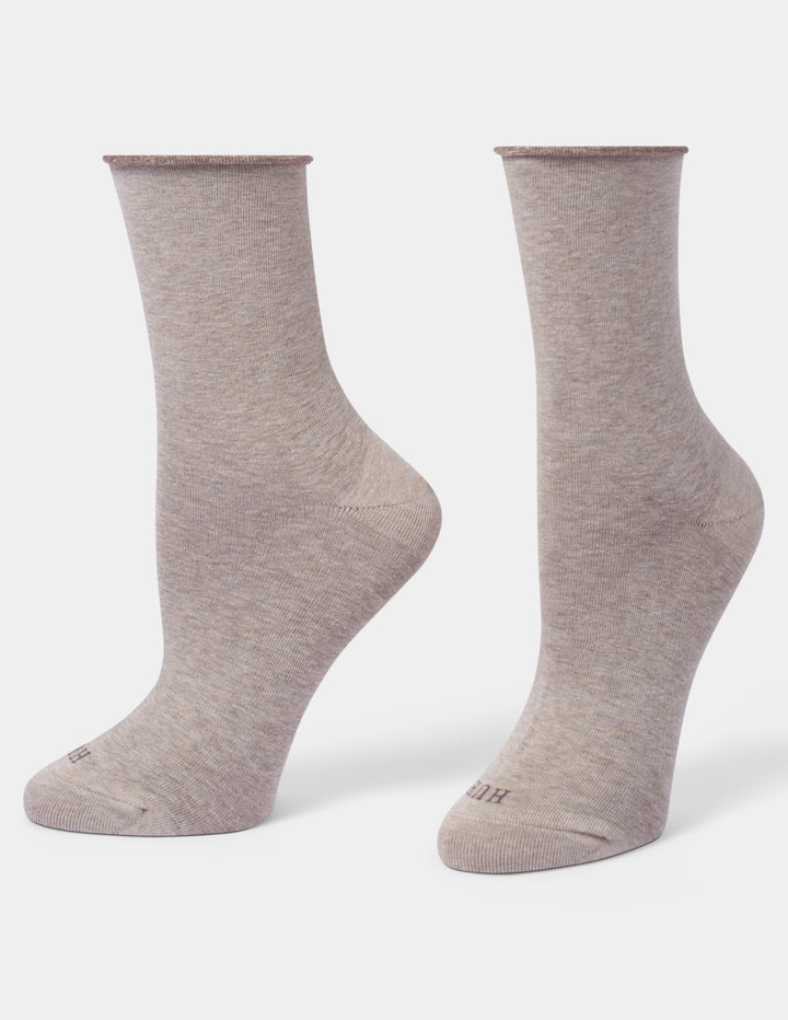A pair of crew-length athletic socks in a heathered taupe-beige color, displayed on invisible forms against a plain white background.