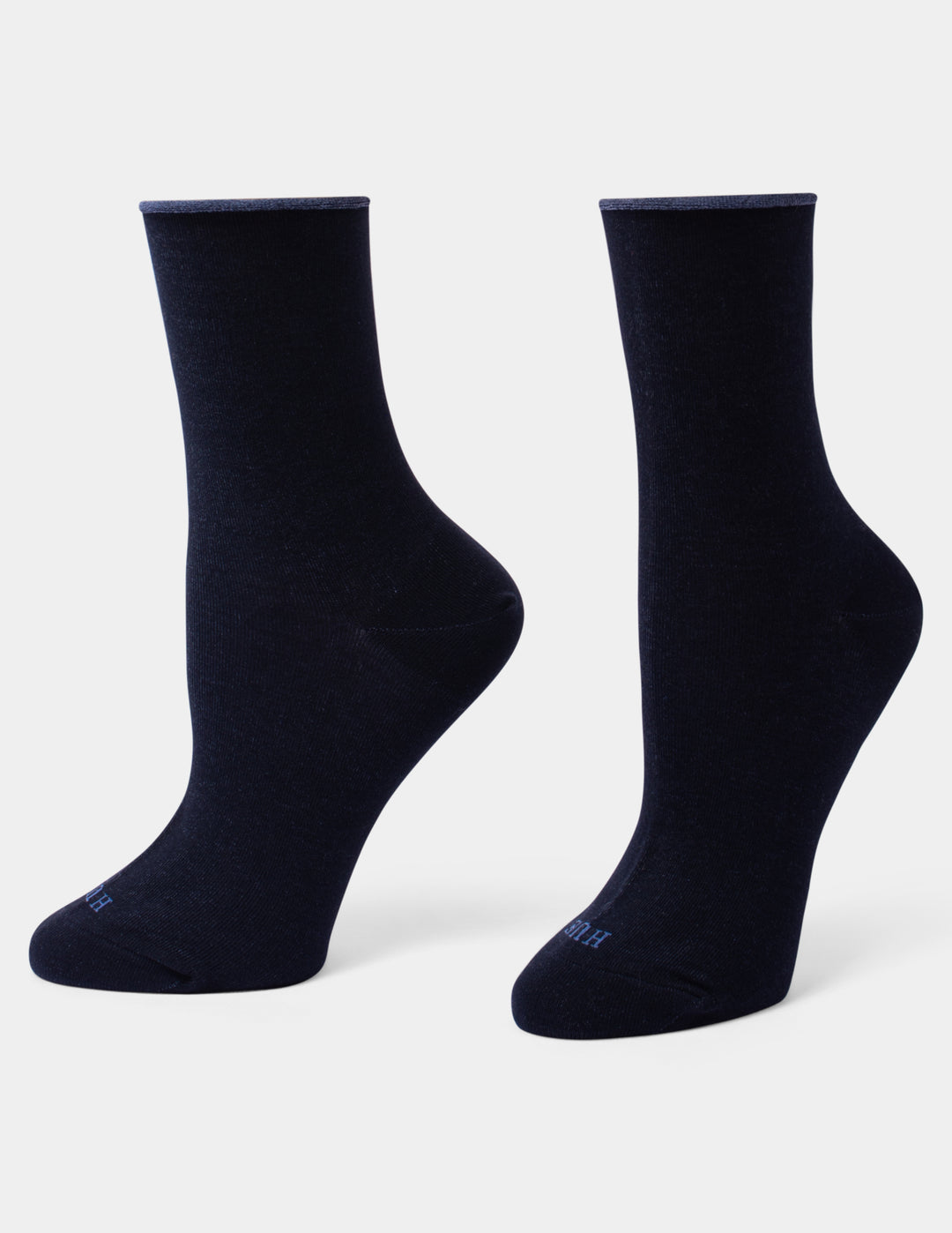 A pair of dark navy blue crew socks displayed on foot forms against a light gray background.