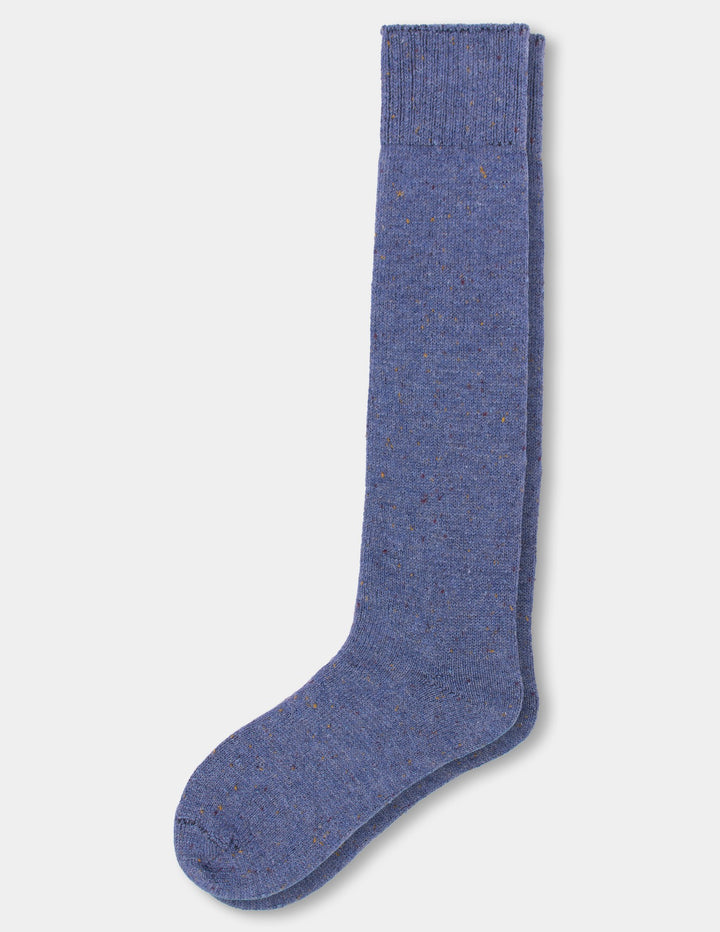A pair of blue tweed knee socks against a light gray background.