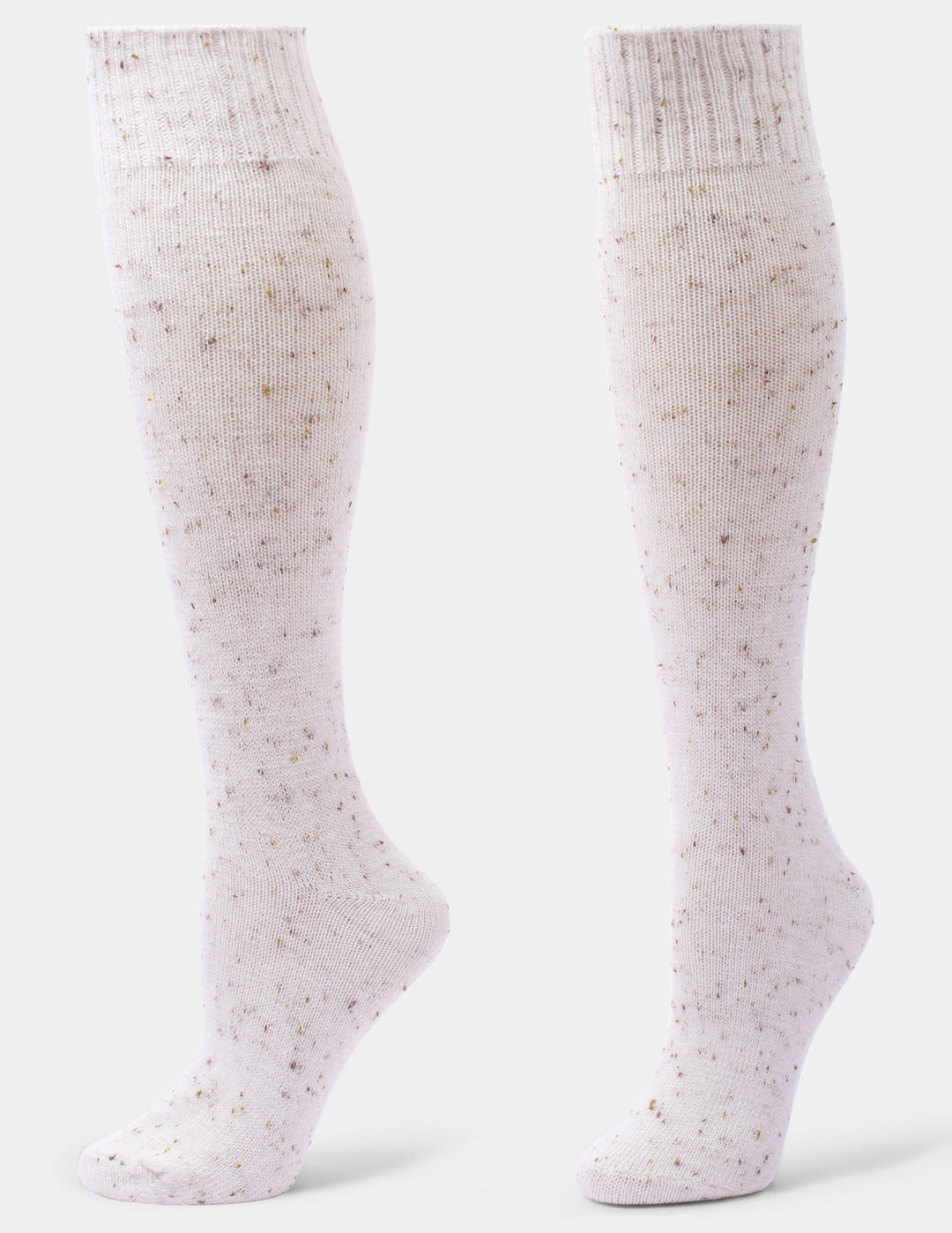 A pair of knee-high knit socks in a very pale pinkish-white with small scattered speckles, shown on invisible forms against a light gray studio background.