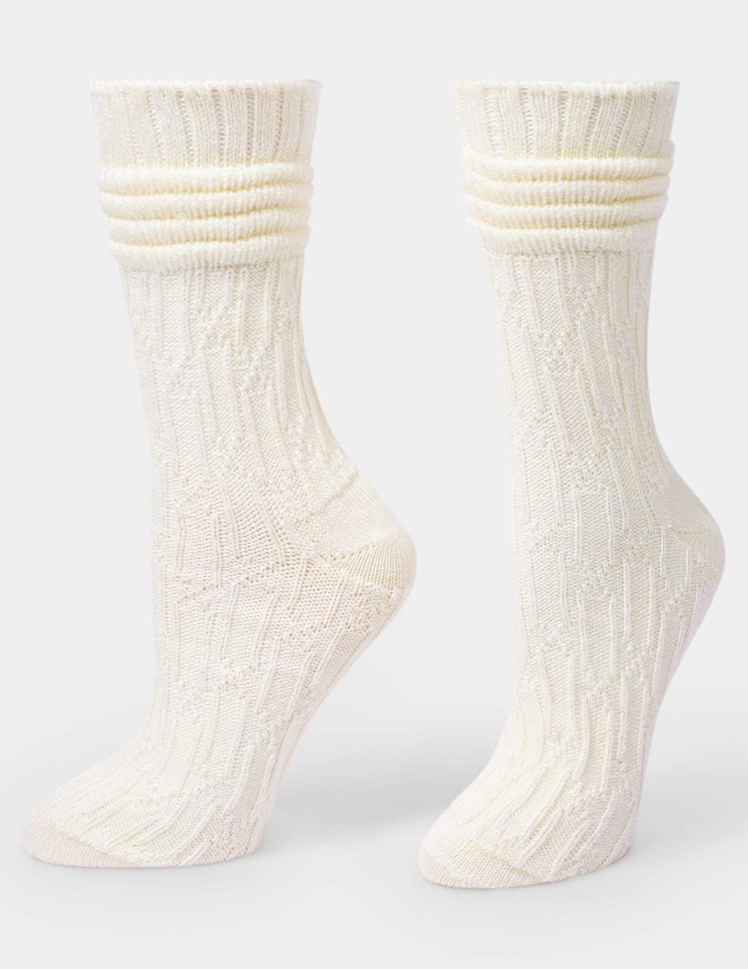 Pair of ivory socks on a grey background