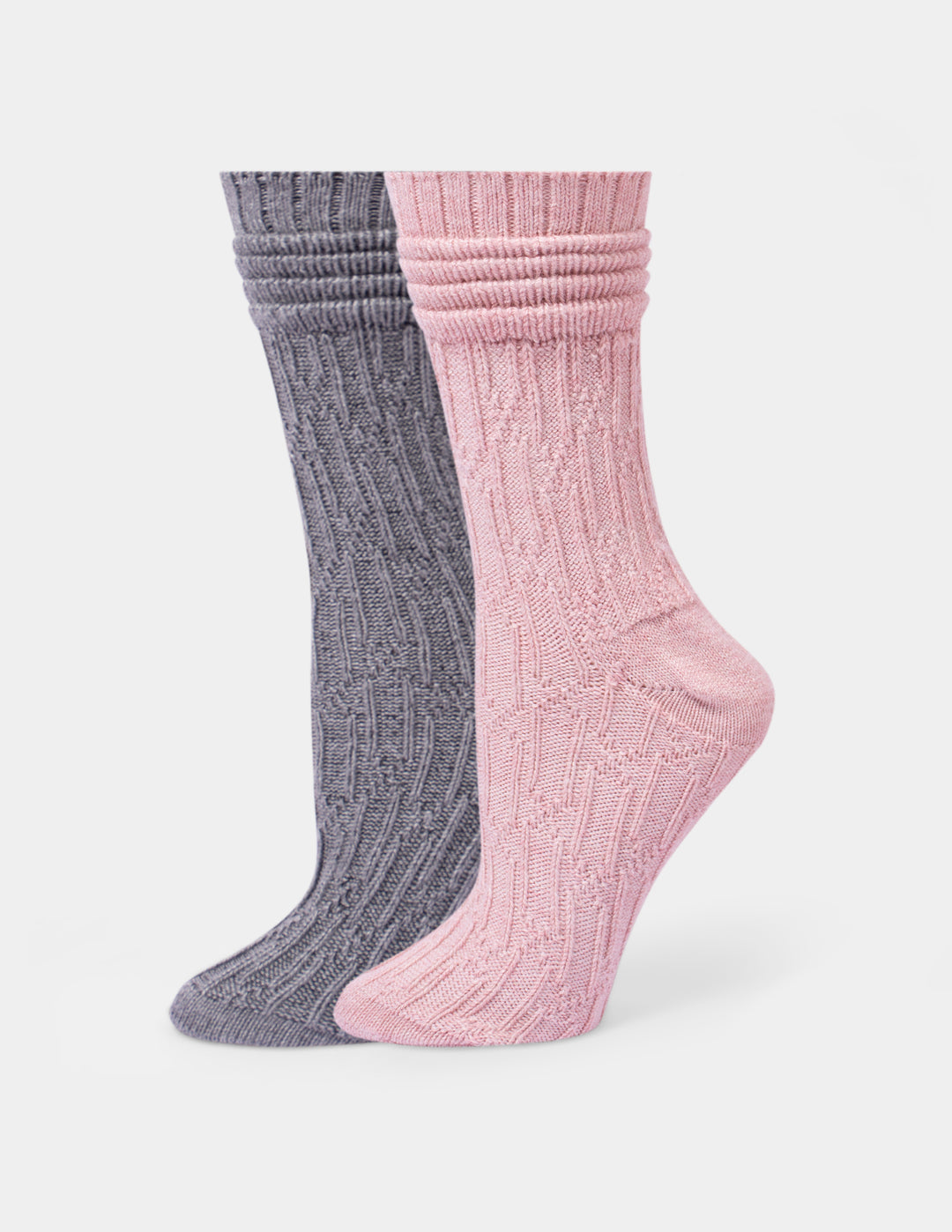 Two pair of ribbed crew socks shown on foot forms, with one sock in heather gray and the other in dusty pink, against a light gray background.