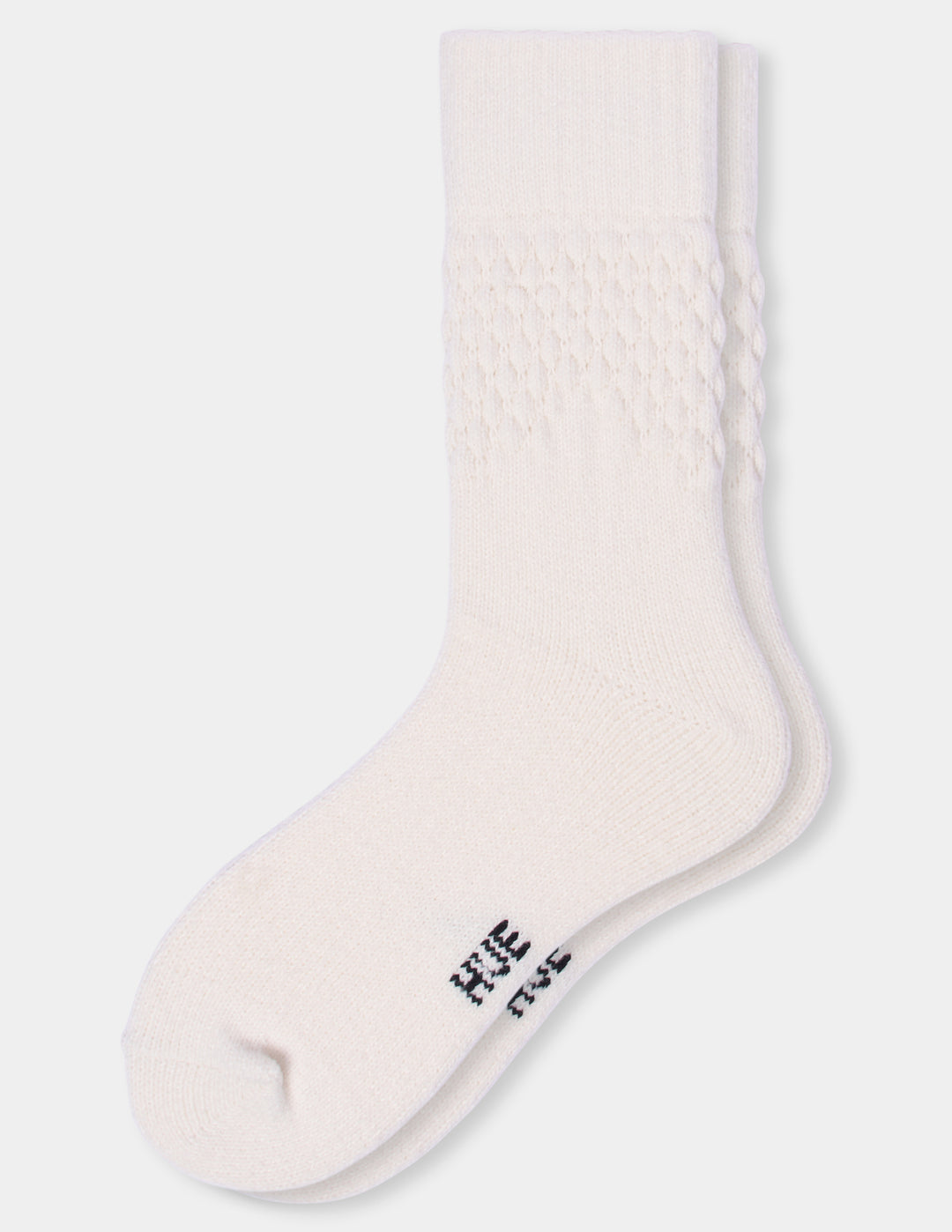 A pair of ivory textured crew socks against a light gray background.
