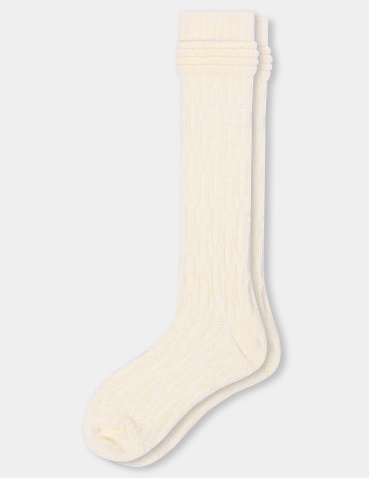 Two cream-colored ribbed knee-high socks stacked vertically on a light gray background.