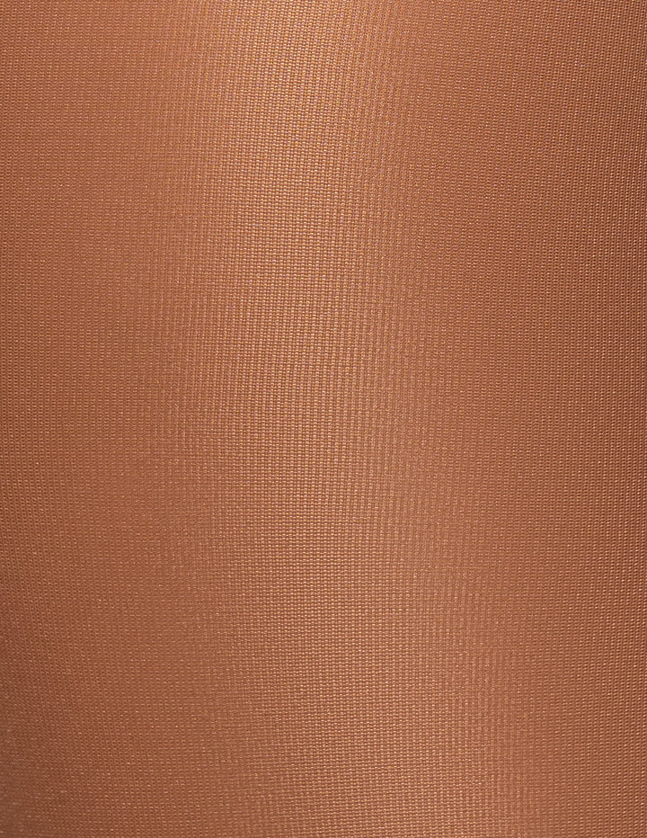 A close-up of a textured fabric in a caramel color.