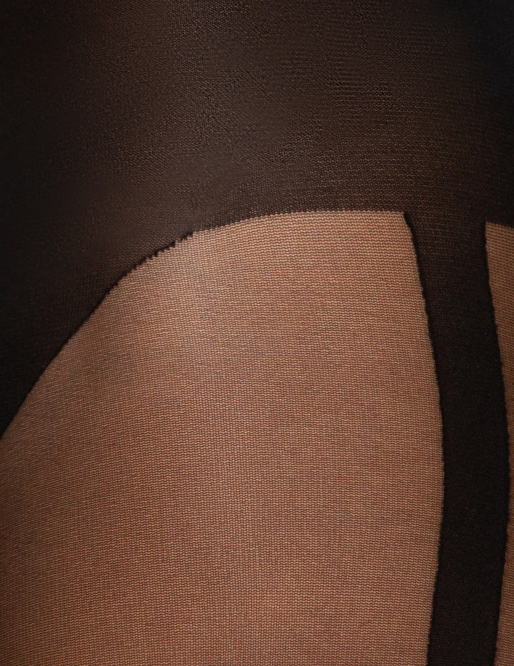 Close-up of sheer black hosiery or a pantyhose leg section over skin, showing the fabric texture and color contrast.