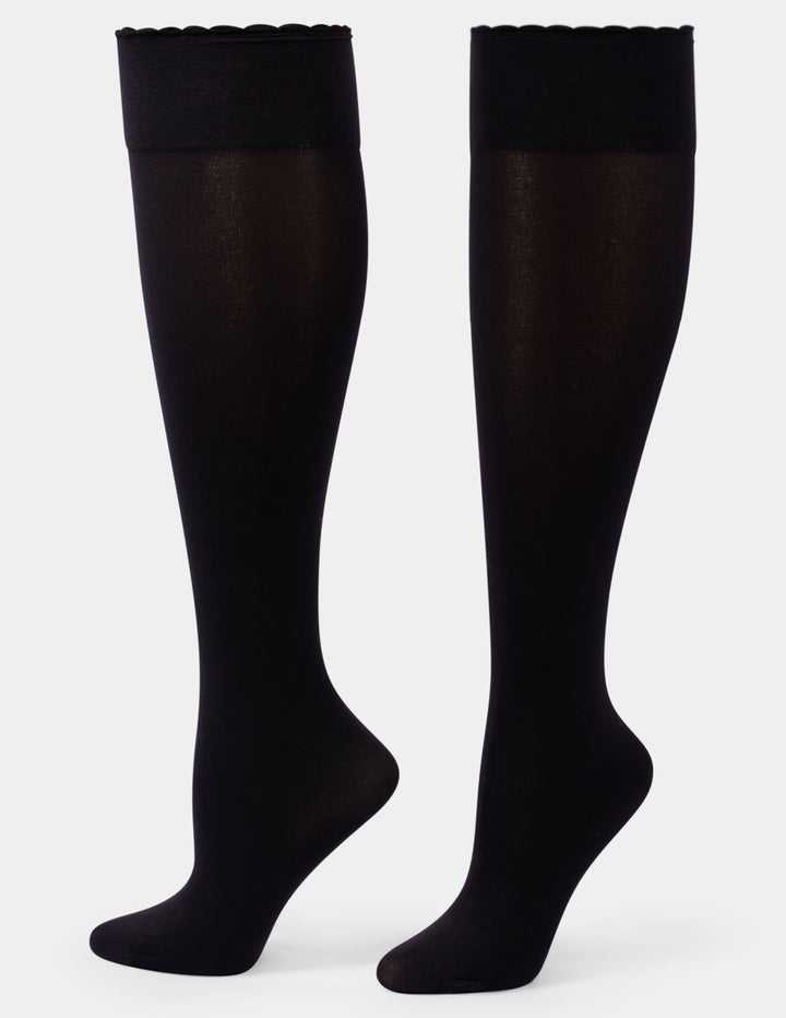 A pair of black over-the-knee sheer socks with solid black cuffs, shown on a light gray background.