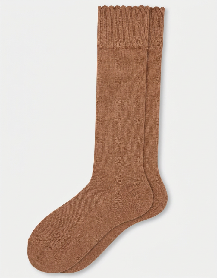 A pair of knee-high socks in a warm brown color on a light gray background.