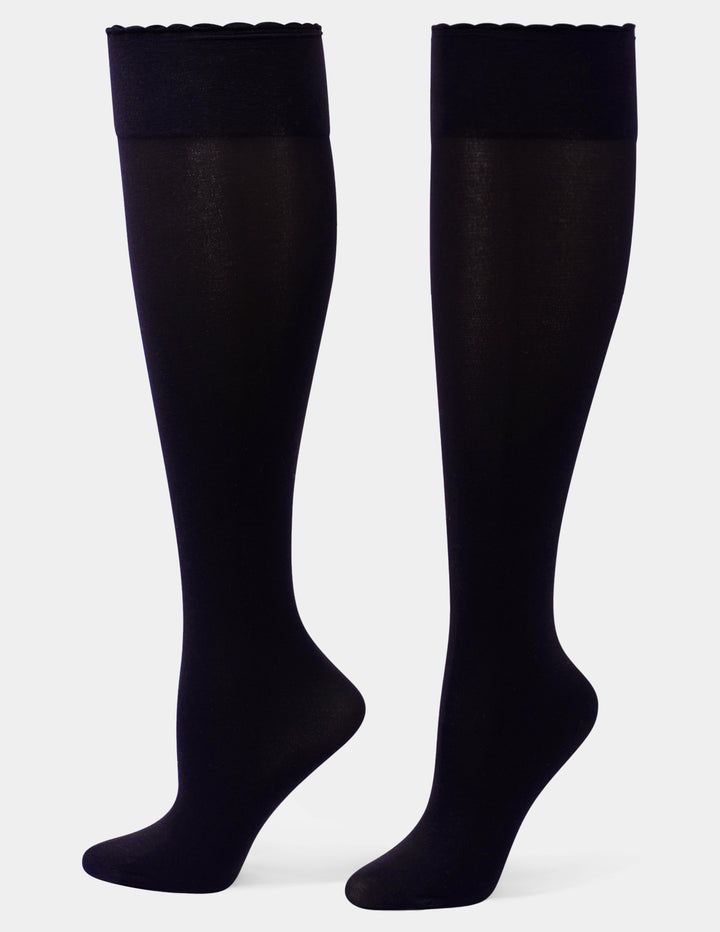 A pair of dark navy over-the-knee socks against a light gray background.