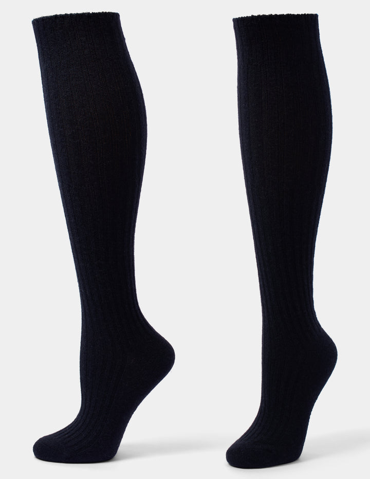 A pair of black ribbed knee-high socks shown from the side against a light gray background.