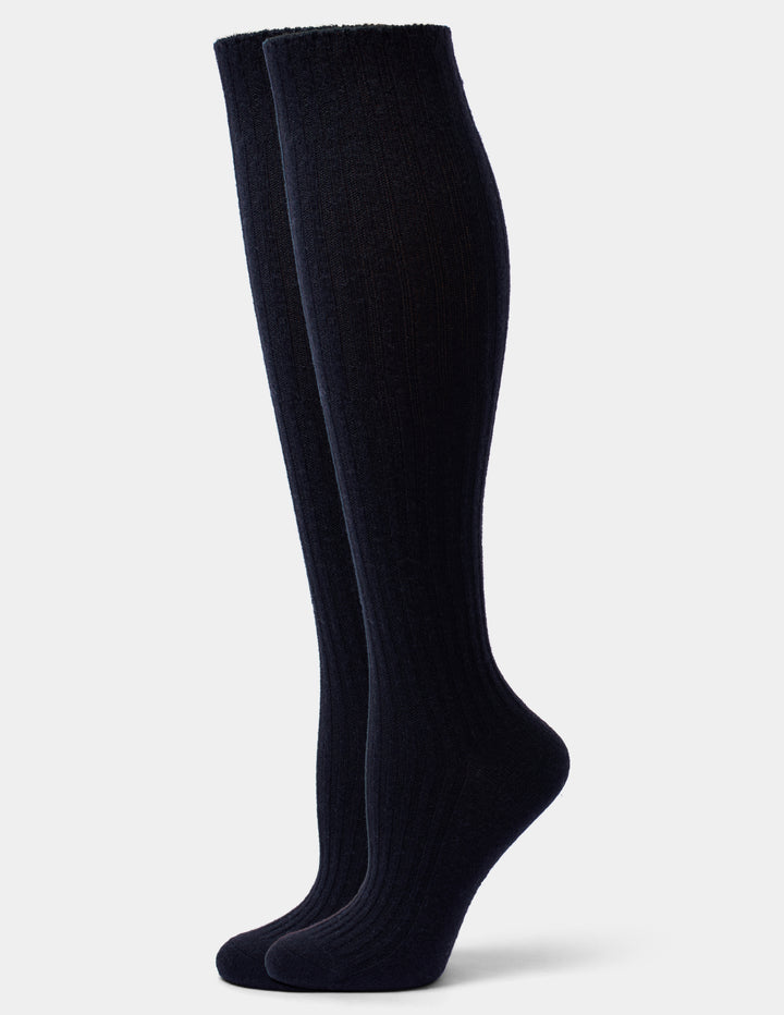 A pair of black ribbed knee-high socks displayed on invisible forms against a solid white background.