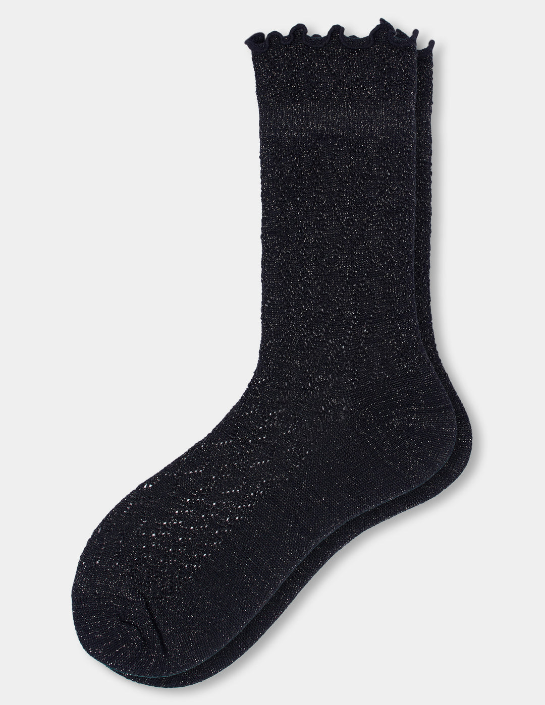 Black pointelle crew socks with metallic accents and a ruffle edge displayed against a light gray background.