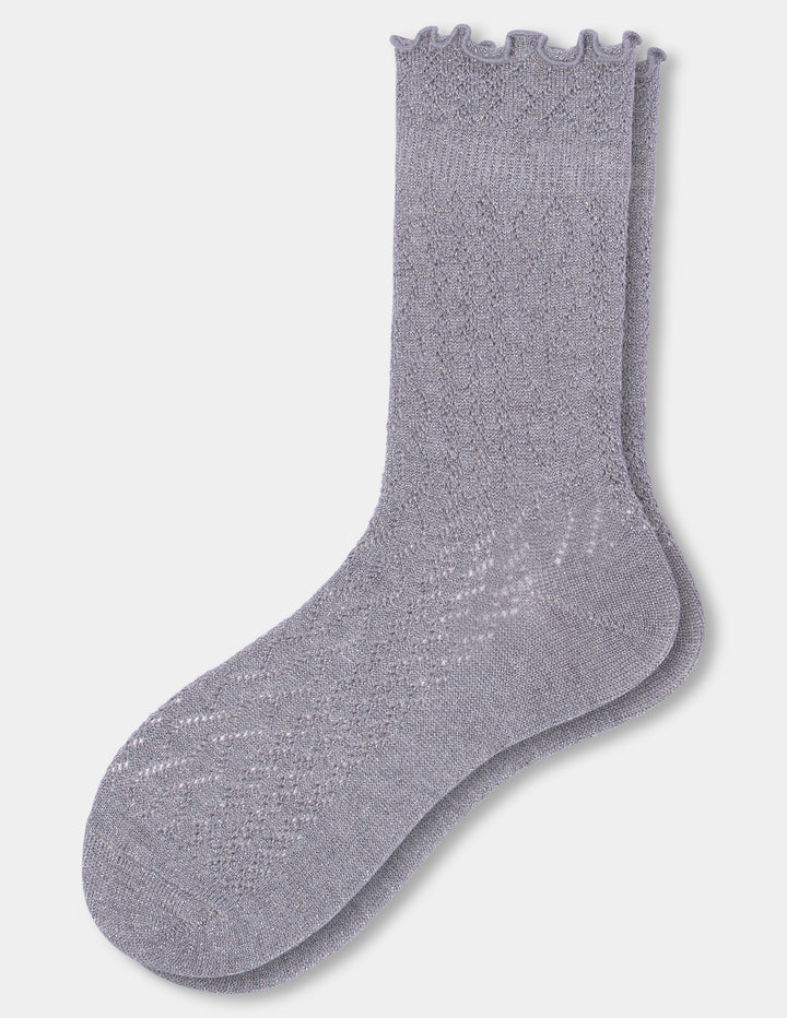 Grey crew socks with a ruffled edge photographed against a light gray background.
