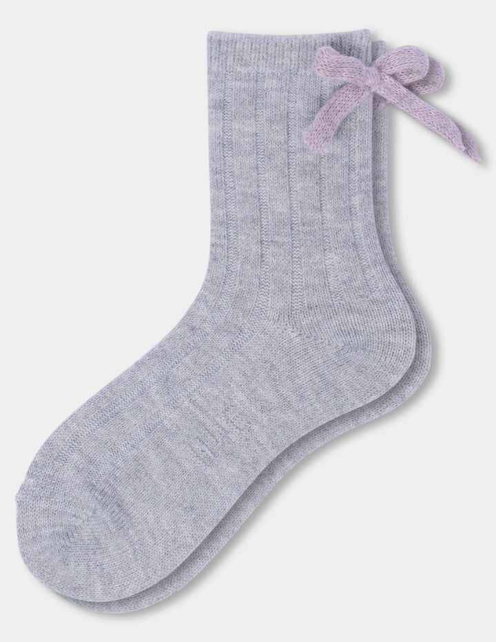 A pair of light grey anklet socks with a pink bow accent, displayed against a light gray background.