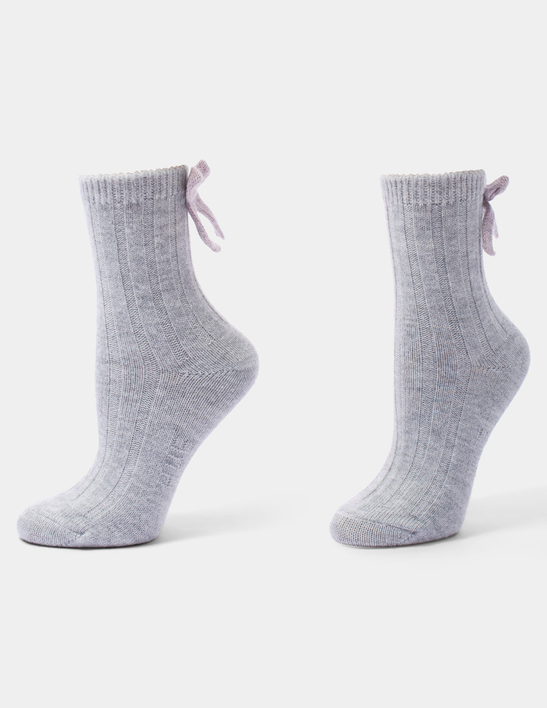 A pair of light grey anklet socks with a pink bow accent, displayed against a light gray background.
