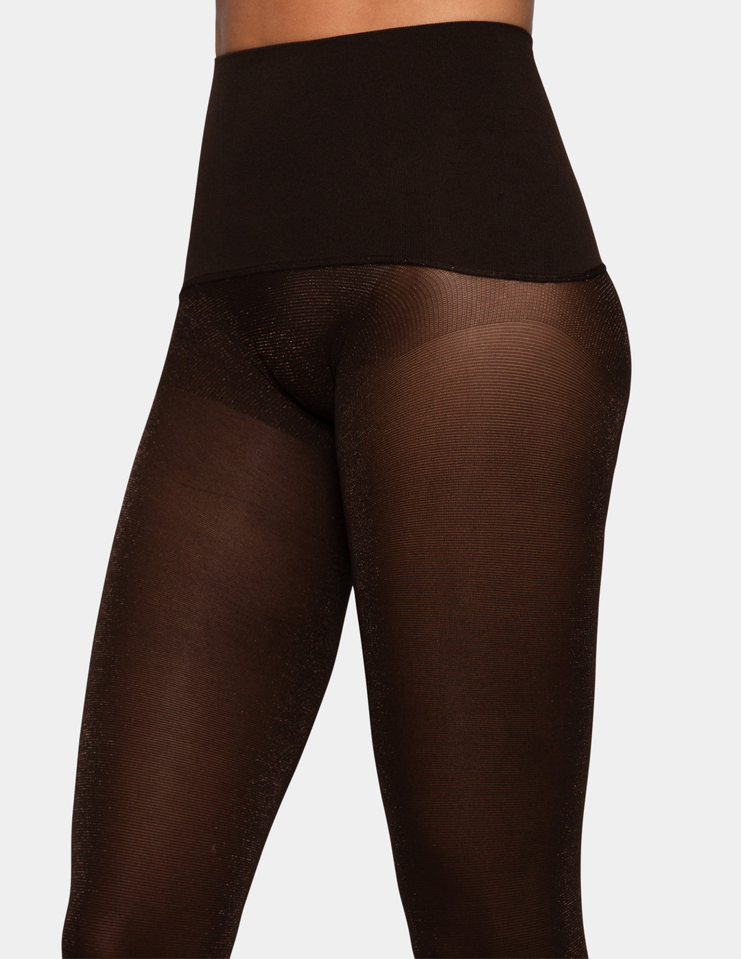 A model wearing brown lurex yoga tights.