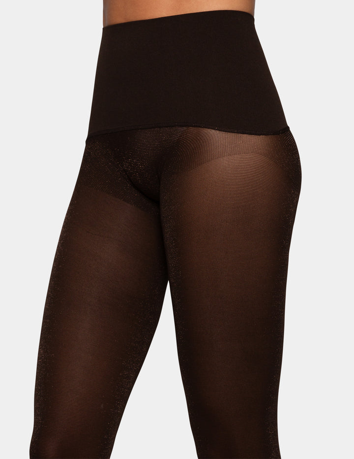 A model wearing brown lurex yoga tights.