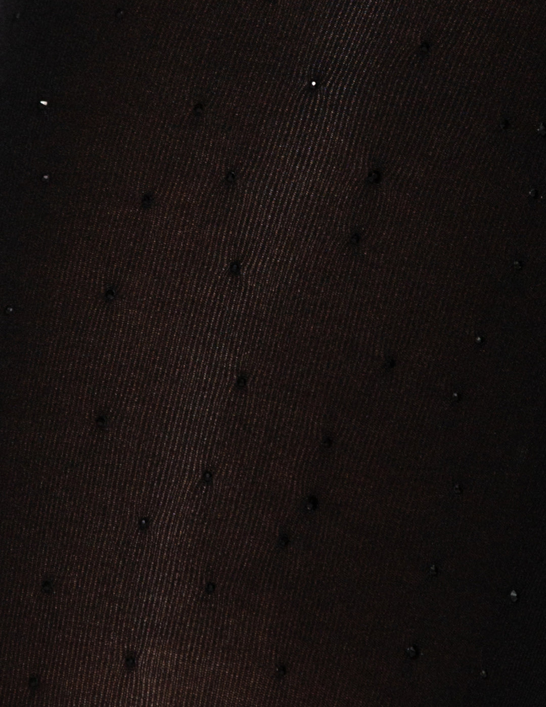 A close up of a black bedazzled fabric material.