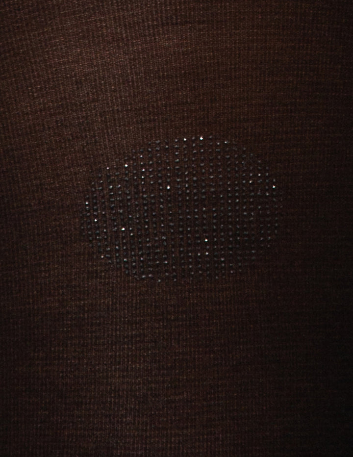 A detailed view of a textured polka dot design displayed on a black fabric material.