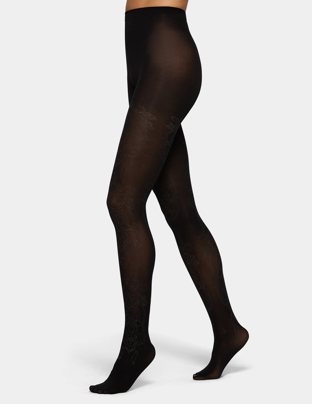 A model wearing black tights photographed against a light grey background.
