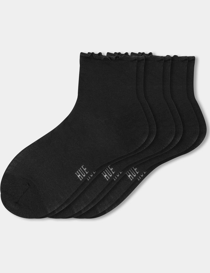 Three pairs of black ankle socks with a ruffled edge and white 'HUE' branding, arranged on a light gray background.
