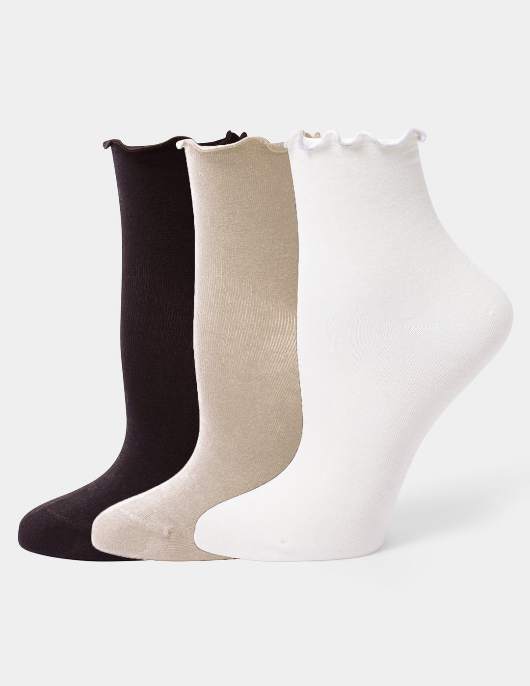 Three pairs of ankle socks with ruffled edges in black, beige, and white, arranged in a row against a light gray background.