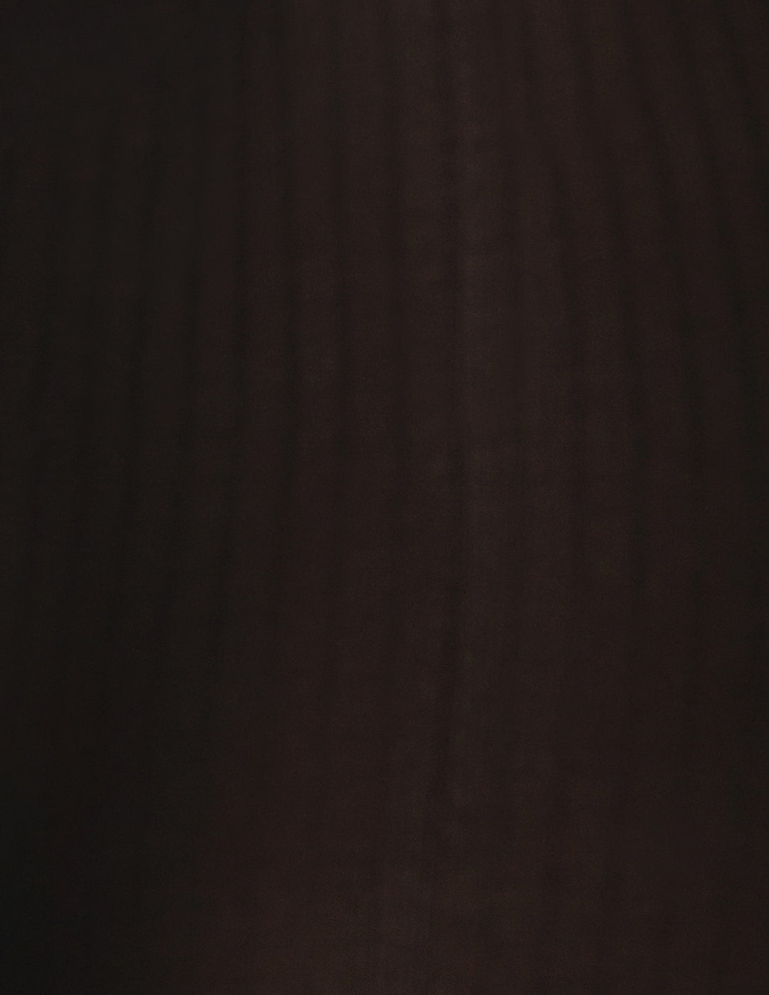 A close-up of a black ribbed material fabric.