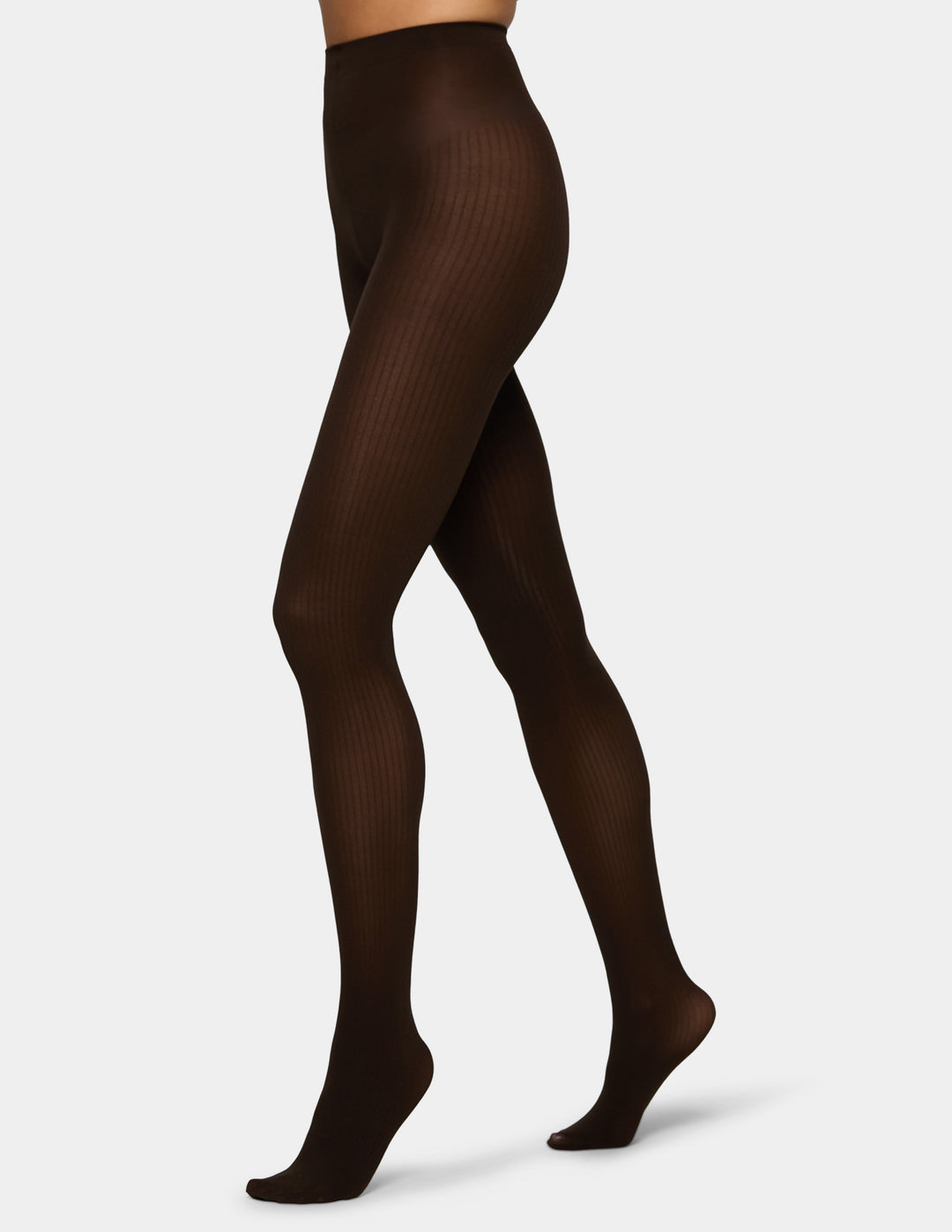 Dark brown ribbed tights worn by a model, shown from the waist down in a side profile view against a plain white background.