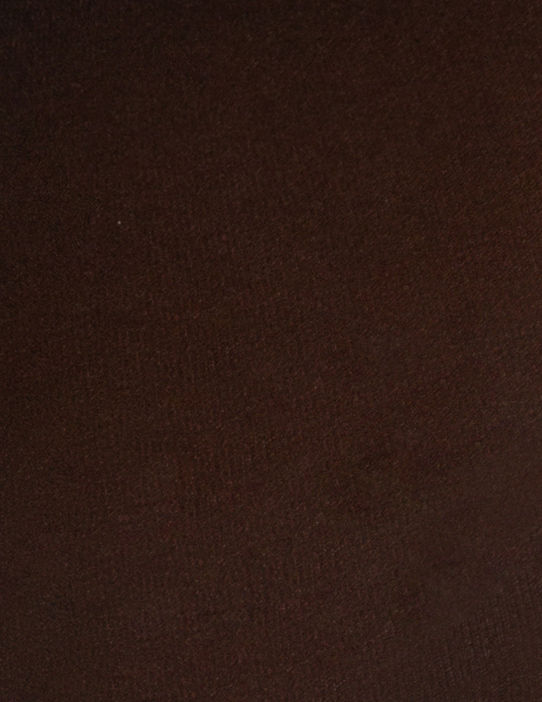 A close-up of a dark brown textured fabric surface.