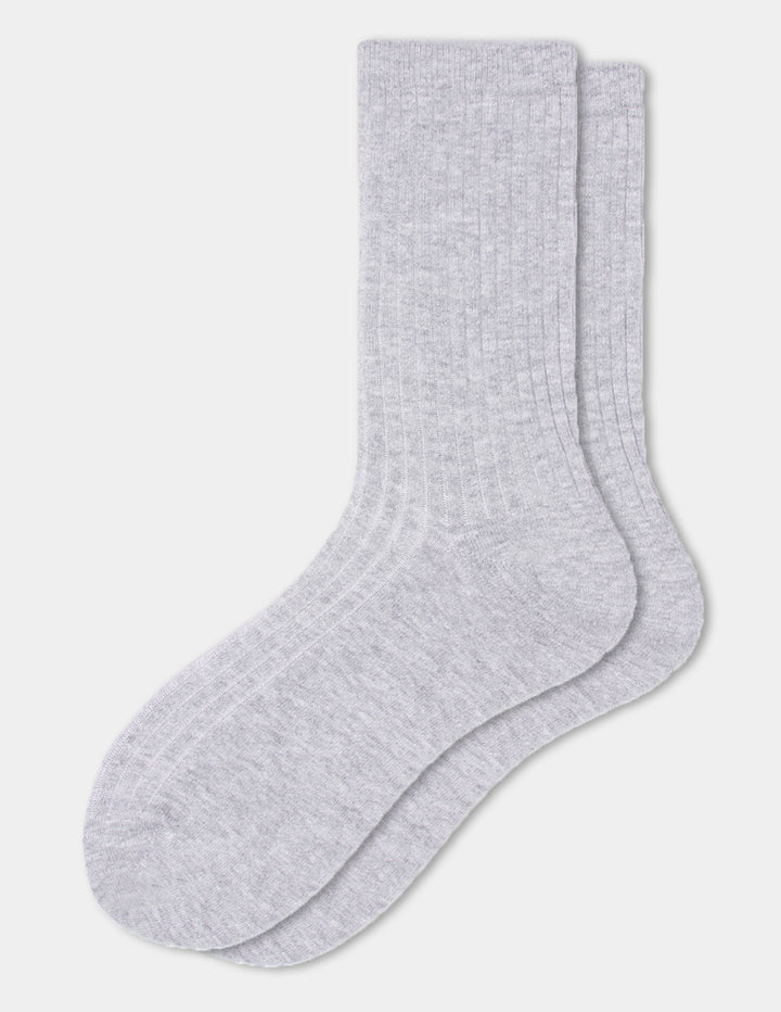 A light grey pair of ribbed crew socks displayed against a light gray background.