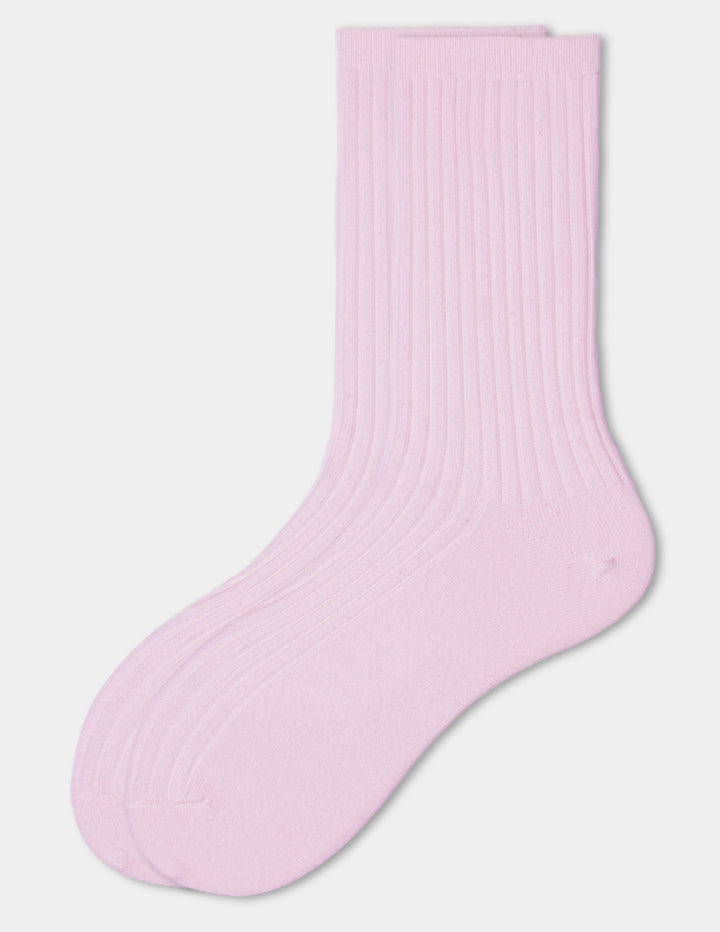 A pair of pink crew socks displayed against a light gray background.