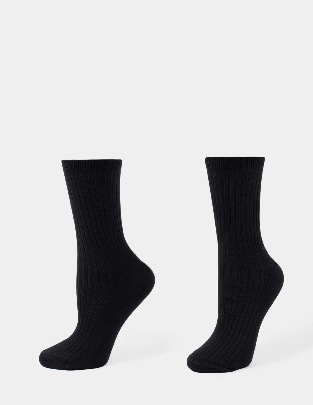 Black crew socks displayed against a light gray background.