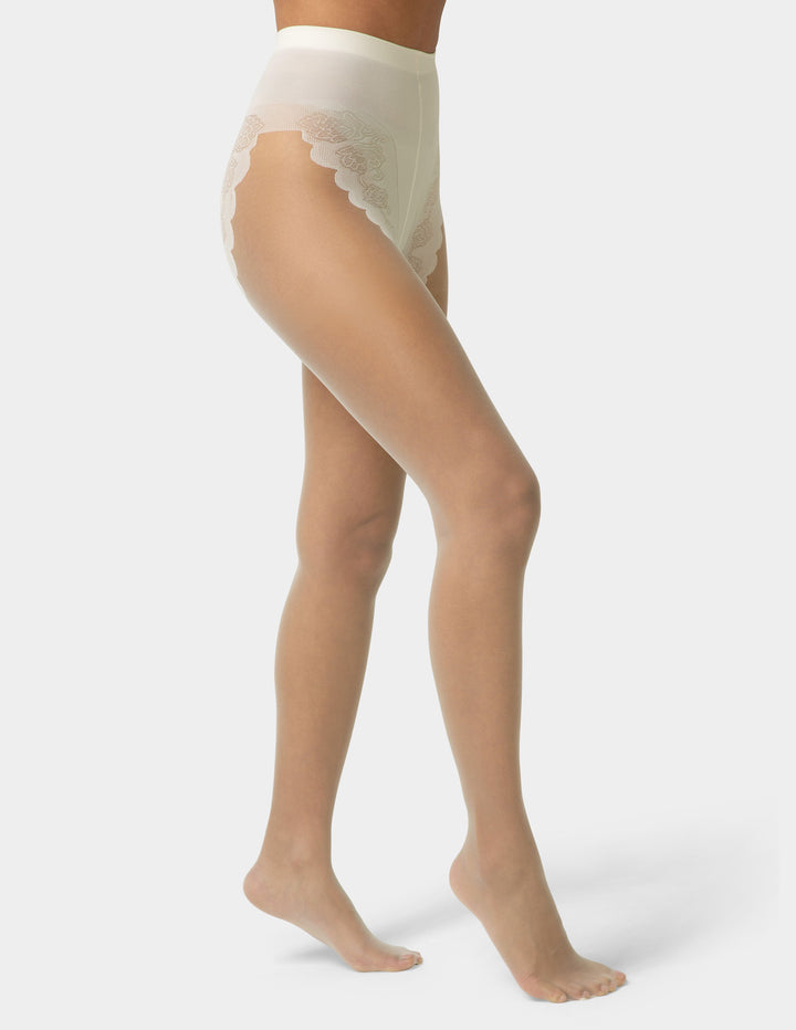 Ivory sheer stockings worn by a person on a white background