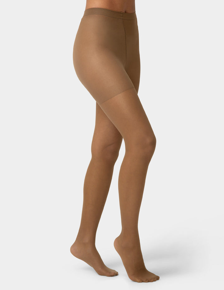 Brown tights worn by a person on a white background