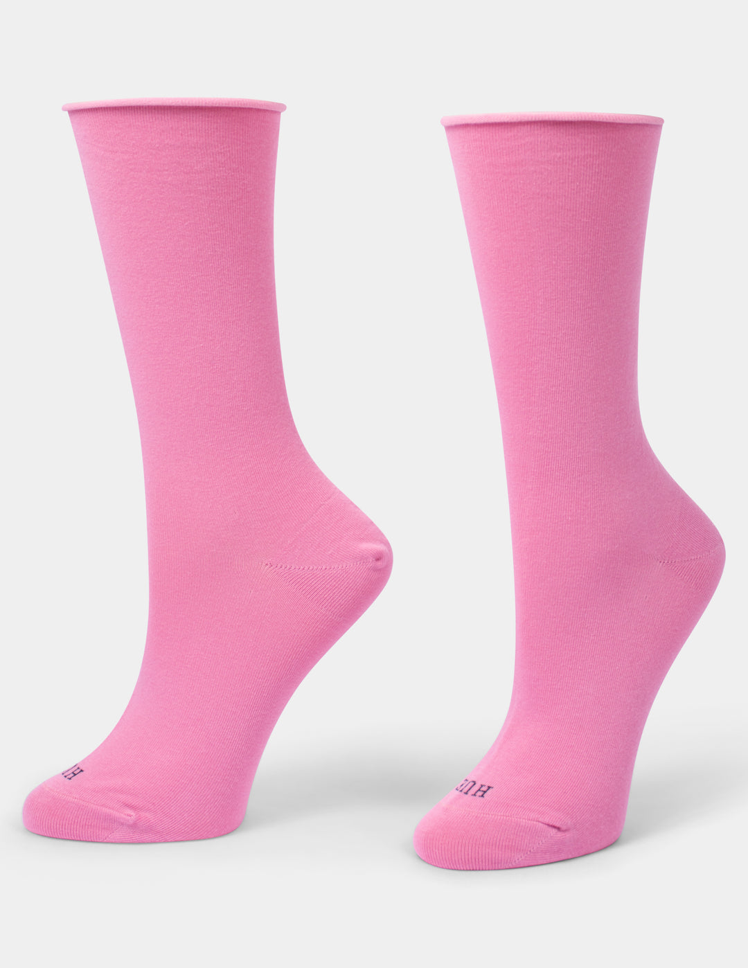 A pair of bright pink crew socks displayed on foot forms against a light gray background.