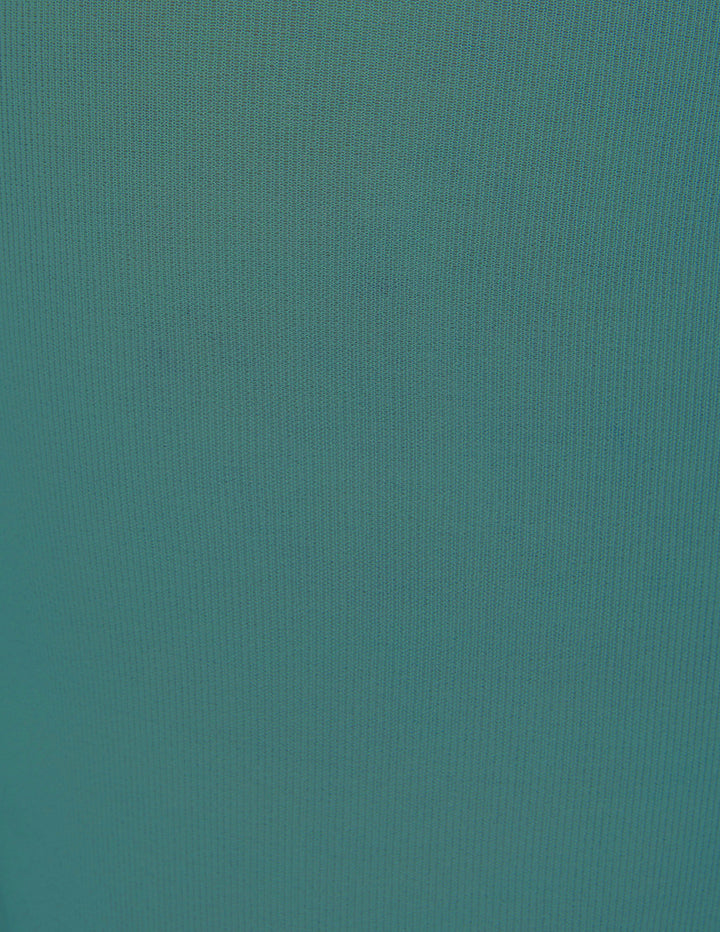 A close-up of a solid teal fabric.