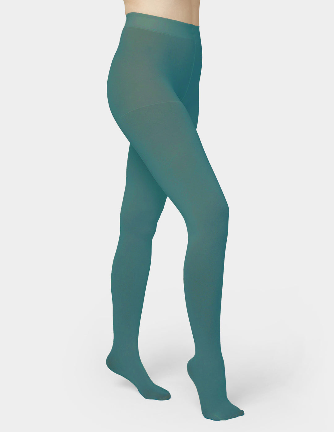 A model's lower body wearing opaque teal tights against a light gray background.