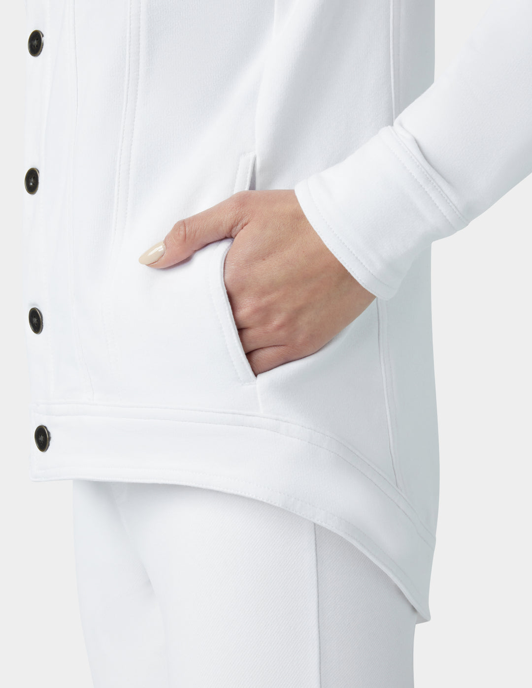 White coat with a hand in the pocket on a light gray background