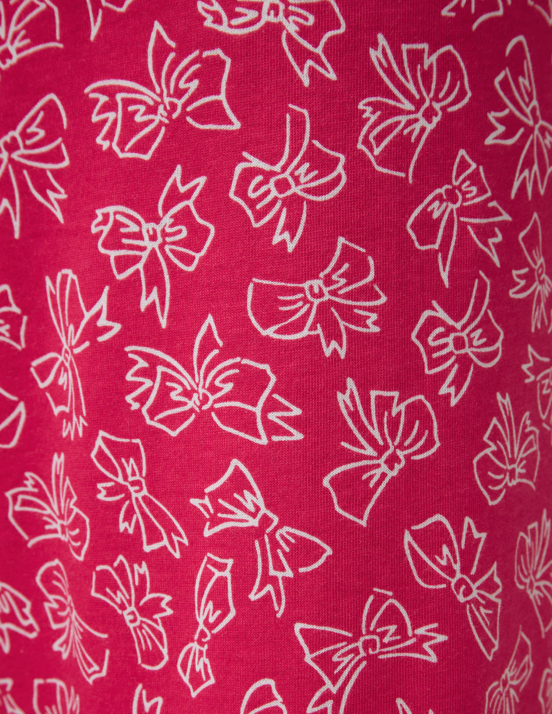 White bows pattern on a hot pink background
