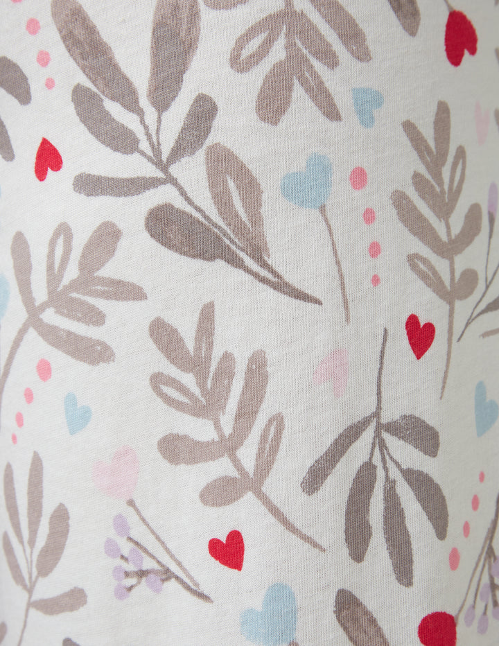 Fabric with leaf and heart pattern on a light background