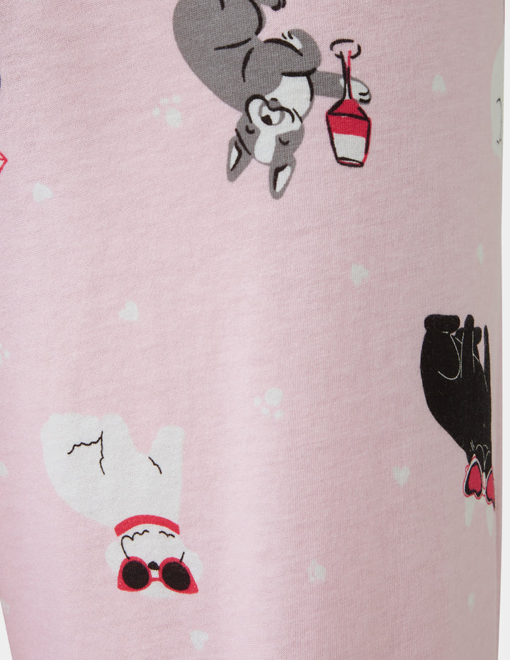 Cartoon characters on a pink background with white polka dots