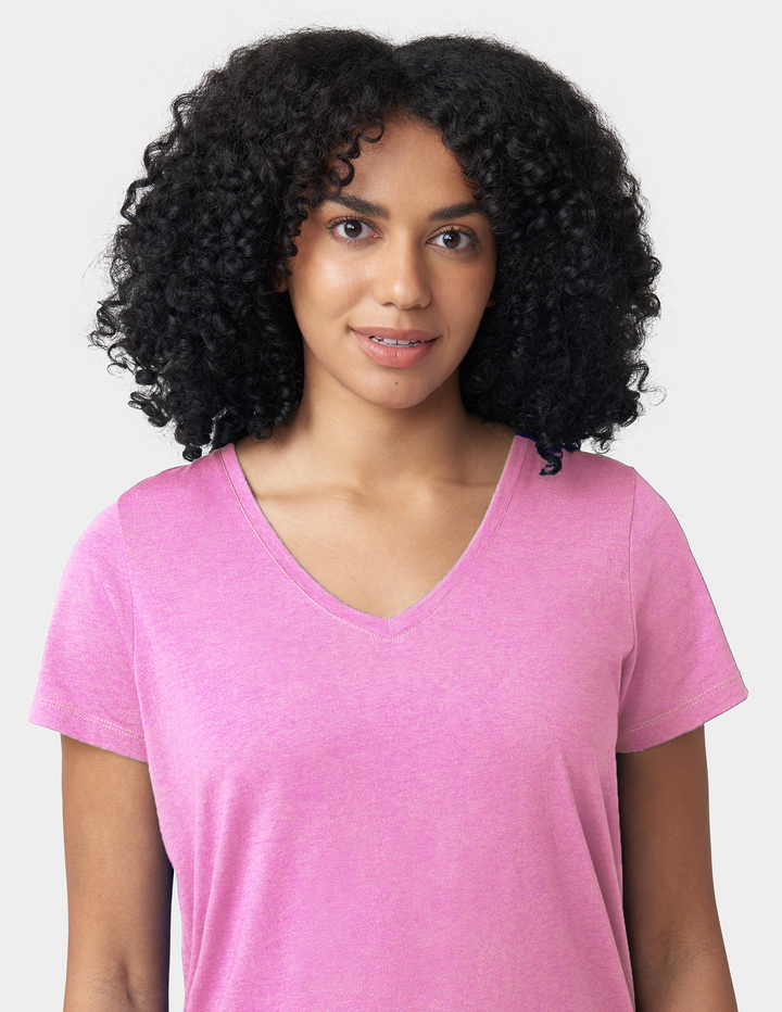Woman wearing a pink shirt against a white background