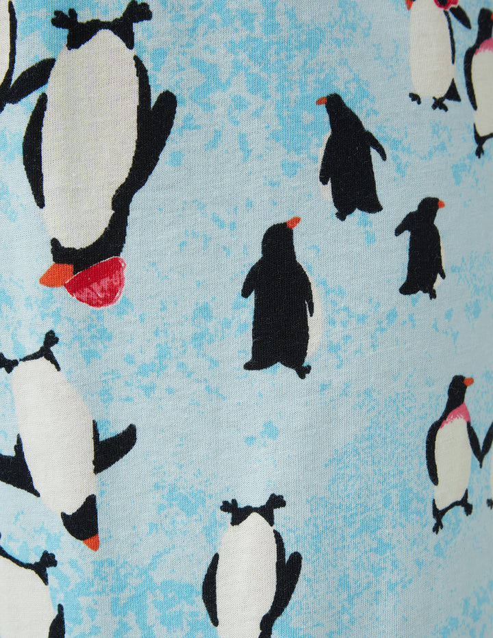 Pattern of penguins on a blue background
