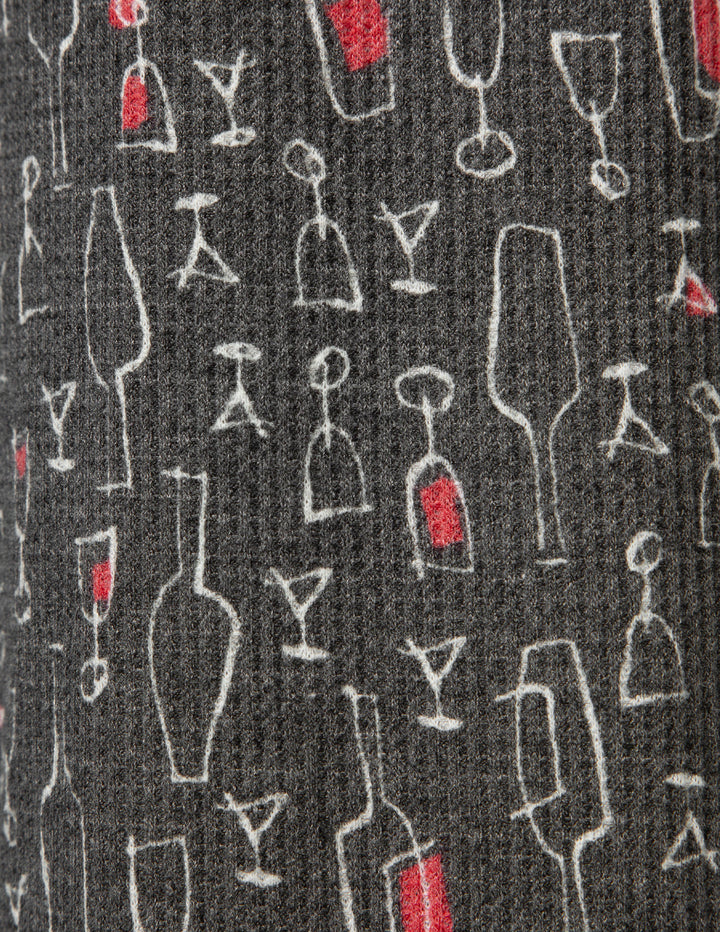 Pattern of wine glasses and bottles on a black background