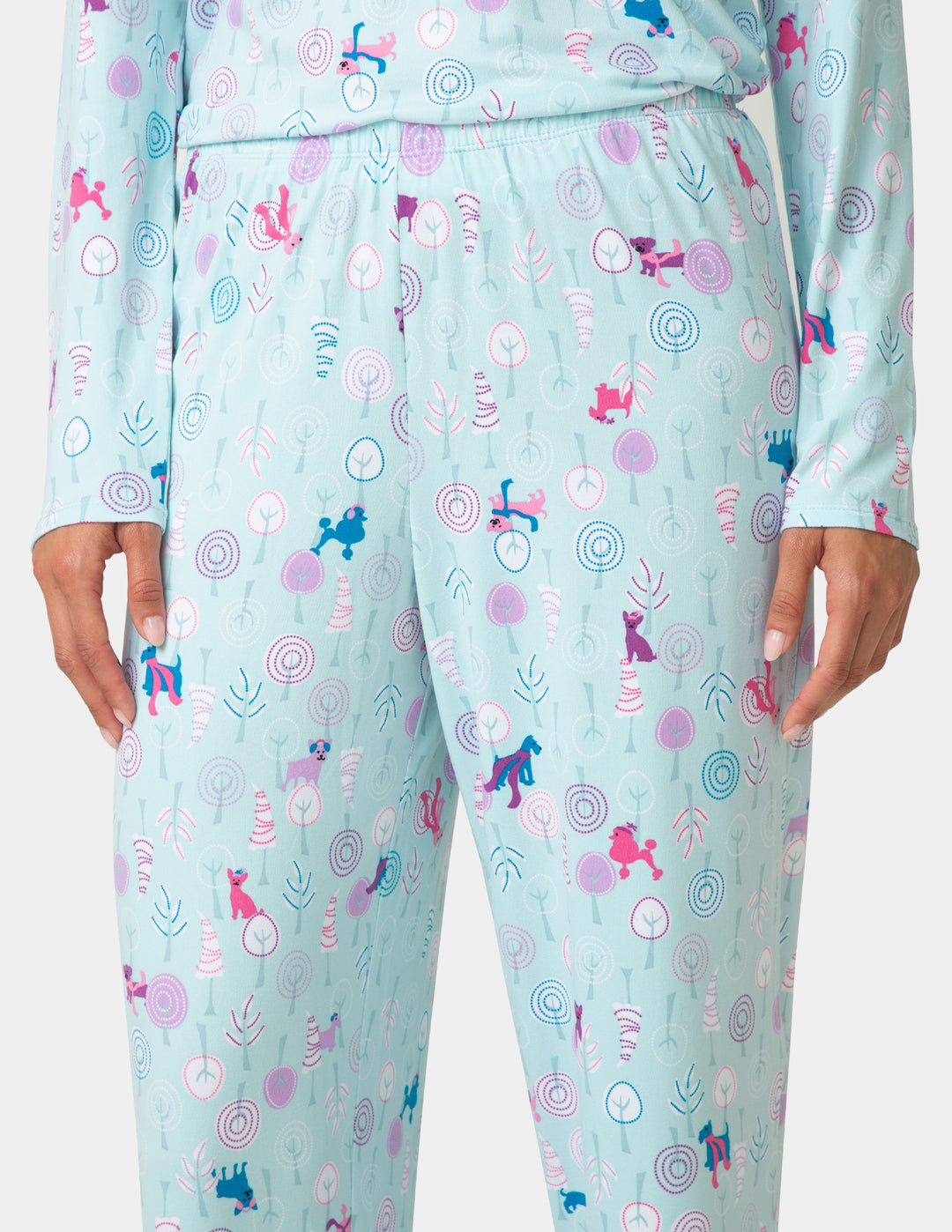 Light blue pajama set with colorful animal pattern on a white background
